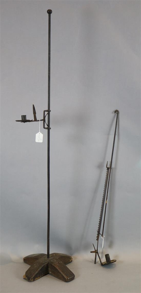 An 18th century iron candle holder on a bracket, and one other on a stand (2)